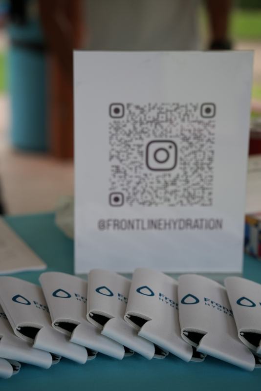 Frontline Hydration Instagram QR sign and branded koozies