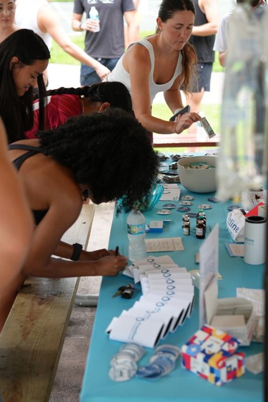 Guests signing up at the Frontline Hydration table