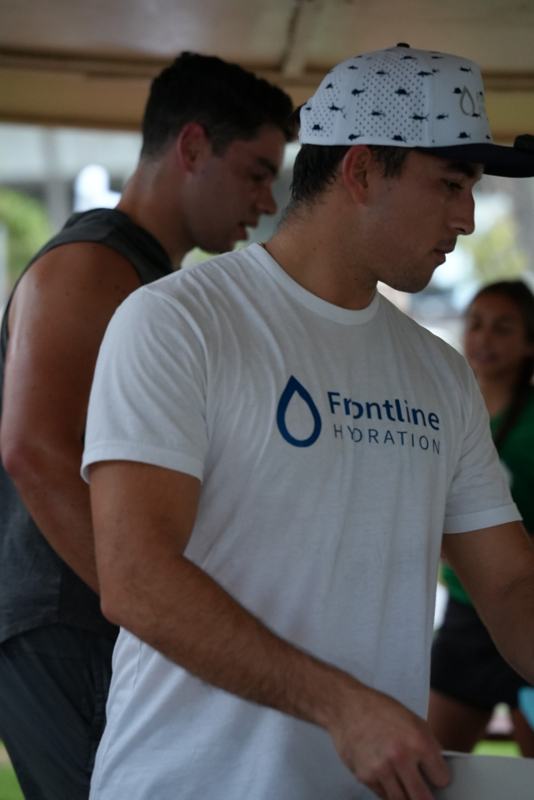 Gabe in a Frontline Hydration shirt at an event
